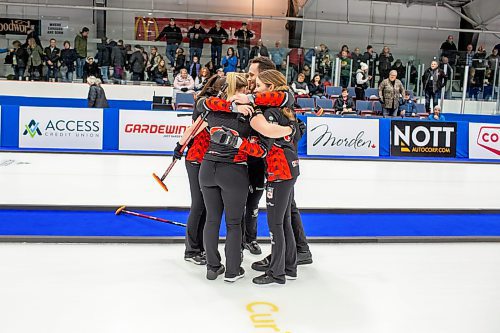 BROOK JONES / WINNIPEG FREE PRESS
Team Lawes from the Fort Rouge Curling Club earned a 9-8 victory of Team Peterson from the Assiniboine Memorial Curling Club in final of 2024 Manitoba Women's Curling Championships - Scotties Tournament of Hearts presented by Rocky Mountain Equipment at the Access Event Centre in Morden, Man., Sunday, Jan. 28, 2024. Pictured: Team Lawes curling coach Connor Njejovan joins in on a victory group hug with skip Kaitlyn Lawes, third Selena Njejovan, second Jocelyn Peterman and lead Kristin MacCuish.