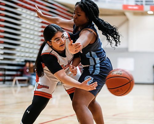 JOHN WOODS / WINNIPEG FREE PRESS
University of Winnipeg Wesmen&#x2019;s Umme Mani Ali (5), left, makes the pass against Grey Academy Raiders&#x2019; Osikhe Lamai (3) as they compete in Winnipeg high school varsity basketball at University of Winnipeg Monday, January  29, 2024. 

Reporter: standup