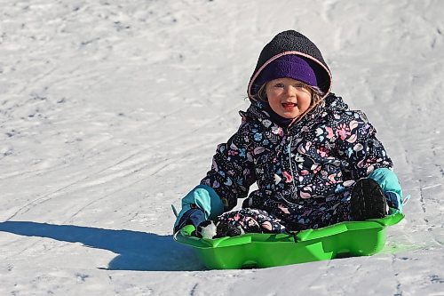 29012024
Clara Gulay smiles while sledding at Elkhorn Resort in Riding Mountain National Park on a clear and warm Monday afternoon. Temperatures in Westman are set to be stay well above normal all week. 
(Tim Smith/The Brandon Sun)