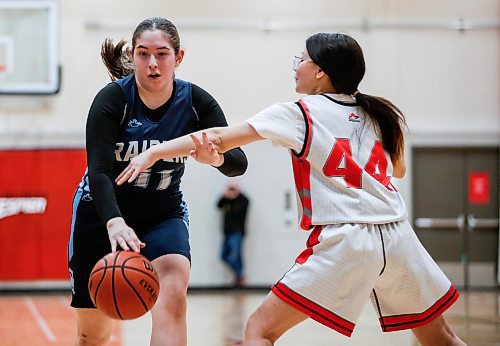 JOHN WOODS / WINNIPEG FREE PRESS
Grey Academy Raiders&#x2019; Lyla Rodin (11) makes her way past University of Winnipeg Wesmen&#x2019;s Memphis Clarke (44) as they compete in Winnipeg high school varsity basketball at University of Winnipeg Monday, January  29, 2024. 

Reporter: standup