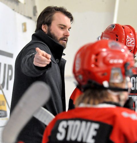 PHOTO D

Southwest Cougars coach Tanner Lewis goes over strategy on the bench with his players after the Yellowhead Chiefs took an early 3-1 lead during a Friday night tilt in Shoal Lake. (Photos by Jules Xavier/The Brandon Sun)