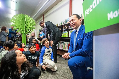 Premier Wab Kinew speaks to students after announcing a universally-accessible school nutrition program at St. George School in Winnipeg on Tuesday. (Mikaela MacKenzie/Winnipeg Free Press)