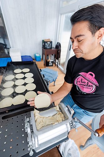 MIKE DEAL / WINNIPEG FREE PRESS
Eduardo Morales puts the tortilla dough through his tortilla maker before placing them on the griddle.
Helena and Eduardo Morales, owners of Los Comales Morales, an artisan tortilla business. 
Helena and Eduardo are both of Mexican descent, she grew up in Manitoba, while Eduardo moved here from Mexico City in 2006, after the two of them met through a friend. 
Eduardo missed the taste of authentic, corn tortillas so he bought an industrial tortilla maker in 2018, and began ordering non-GMO, organic corn flour from a distributor in Iowa, expressly to make tortillas for family and friends. But since he was required to buy one ton of flour, per order, he started thinking maybe others would enjoy their tortillas, too; the business launched in August, 2023.
240130 - Tuesday, January 30, 2024.