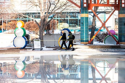 MIKAELA MACKENZIE / WINNIPEG FREE PRESS

Navdeep Sharma (left) and Nitesh Goswami walk past the closed (and partially melted) canopy rink at The Forks on Tuesday, Jan. 30, 2024. For Malak story.
Winnipeg Free Press 2024.