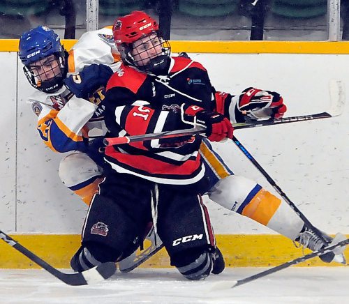 Yellowhead Chiefs rookie winger Quinn Schutte battles for the puck on the wall in Shoal Lake with Southwest Cougars' top scorer Jack Clark (15). The 11th-place Chiefs prevailed 5-3 hosting the second-place Cougars. (Jules Xavier/The Brandon Sun)