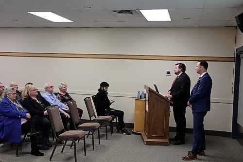 Finance Minister Adrien Sala and Brandon East MLA Glen Simard listen to feedback on this year's provincial budget at a consultation session at the Riverbank Discovery Centre on Wednesday evening. (Colin Slark/The Brandon Sun)