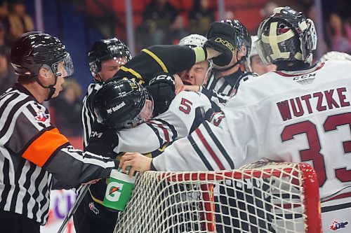 02022024
Caleb Hadland #10 of the Brandon Wheat Kings and Hunter Mayo #5 of the Red Deer Rebels cuddle during WHL action at Westoba Place on Friday evening.
(Tim Smith/The Brandon Sun)