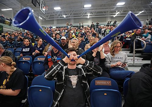 02022024
Sean Taron blows his horns while cheering a Brandon University Bobcats point along with other fans during men&#x2019;s university volleyball action against the Mount Royal University Cougars at the BU Healthy Living Centre on Friday evening.
(Tim Smith/The Brandon Sun)