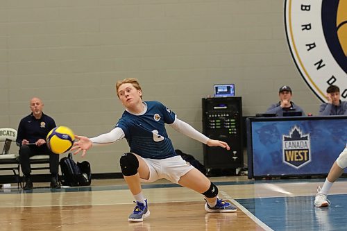 Brandon University libero Kale Fisher lunges for a ball. (Thomas Friesen/The Brandon Sun)