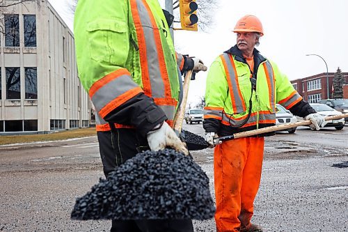 05022024
Nathaniel Hegg and Harry Davis with Manitoba Transportation and Infrastructure fill potholes with asphalt at the intersection of 18th Street and Victoria Avenue in Brandon on a mild Monday. The constant free/thaw cycle of our recent mild weather has kept road crews busy with pothole repairs. 
(Tim Smith/The Brandon Sun)