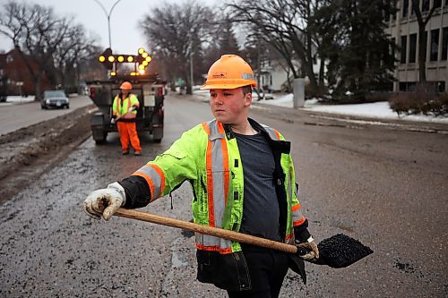 05022024
Nathaniel Hegg (foreground) and Harry Davis with Manitoba Transportation and Infrastructure fill potholes with asphalt at the intersection of 18th Street and Victoria Avenue in Brandon on a mild Monday. The constant free/thaw cycle of our recent mild weather has kept road crews busy with pothole repairs. 
(Tim Smith/The Brandon Sun)