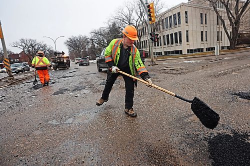 05022024
Nathaniel Hegg with Manitoba Transportation and Infrastructure fills potholes with asphalt at the intersection of 18th Street and Victoria Avenue in Brandon on a mild Monday. The constant free/thaw cycle of our recent mild weather has kept road crews busy with pothole repairs. 
(Tim Smith/The Brandon Sun)