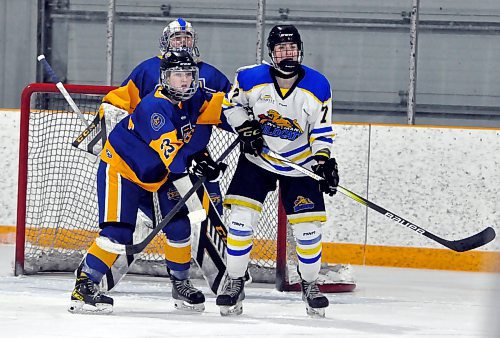 During a second-period power-play, Westman Wildcats sophomore forward Reese Schutte provides a screen in front of Yellowhead Chiefs goalie Clair Merckx, while being defended by Chiefs rearguard Grace Kirk (23). *(Jules Xavier/The Brandon Sun)