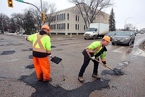 05022024
Harry Davis and Nathaniel Hegg with Manitoba Transportation and Infrastructure fill potholes with asphalt at the intersection of 18th Street and Victoria Avenue in Brandon on Monday. (Tim Smith/The Brandon Sun)