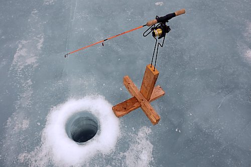 06022024
A fishing line disappears into the water under the ice at Brenda Hopkie&#x2019;s ice fishing shack on the Rivers Reservoir on a mild Tuesday, which also happened to be Brenda&#x2019;s birthday.
(Tim Smith/The Brandon Sun)