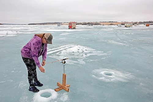 06022024
Brenda Hopkie checks one of her fishing lines at her ice fishing shack on the Rivers Reservoir on a mild Tuesday, which also happened to be Brenda’s birthday.
(Tim Smith/The Brandon Sun)