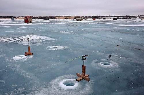 06022024
Fishing lines disappear into the water under the ice at Brenda Hopkie&#x2019;s ice fishing shack on the Rivers Reservoir on a mild Tuesday, which also happened to be Brenda&#x2019;s birthday.
(Tim Smith/The Brandon Sun)