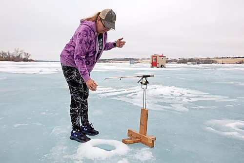 06022024
Brenda Hopkie&#x2019;s checks one of her fishing lines at her ice fishing shack on the Rivers Reservoir on a mild Tuesday, which also happened to be Brenda&#x2019;s birthday.
(Tim Smith/The Brandon Sun)