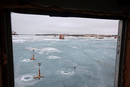 06022024
Fishing lines disappear into the water under the ice at Brenda Hopkie&#x2019;s ice fishing shack on the Rivers Reservoir on a mild Tuesday, which also happened to be Brenda&#x2019;s birthday.
(Tim Smith/The Brandon Sun)