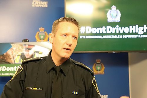 WPS impaired driving countermeasures coordinator Sgt. Stephan Fontaine, who demonstrates the technology police use to analyze saliva swabs and identify drug-impaired drivers. (Tyler Searle / Winnipeg Free Press)