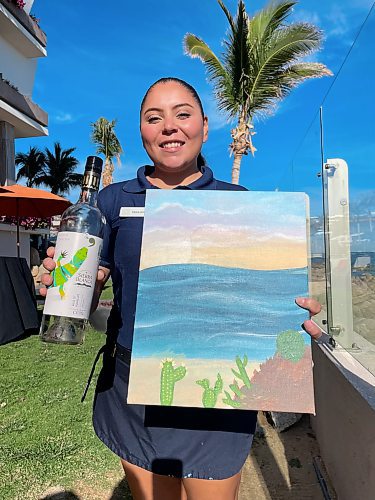 Photos by Steve MacNaull / Winnipeg Free Press
Karina Arriaga, an activities agent at the Grand Velas Resort Los Cabos, shows off the wine and seascape used for the Painting and Wine class. 