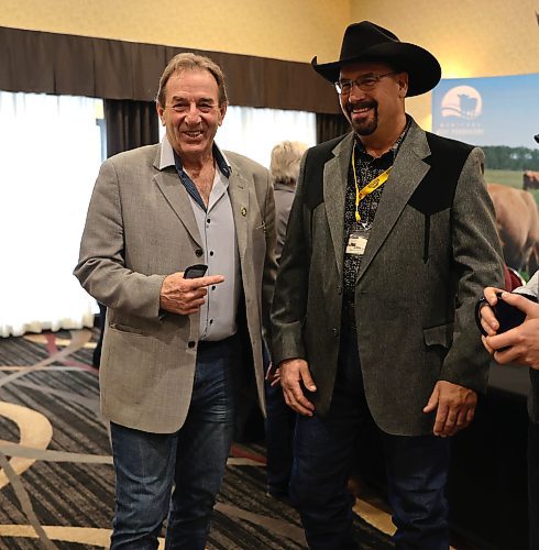 Manitoba Agriculture Minister Ron Kostyshyn stands next to Mark Good, Manitoba Beef Producers treasurer, during the annual general meeting for the provincewide association in Brandon's Victoria Inn on Thursday. (Michele McDougall/The Brandon Sun)