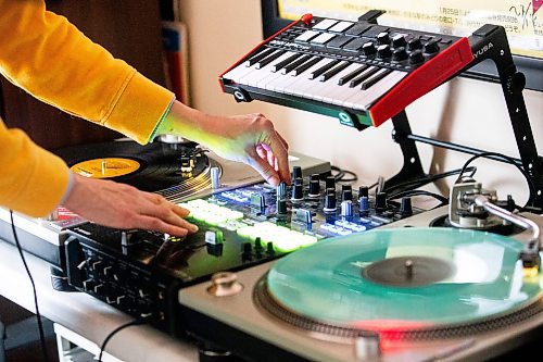 MIKAELA MACKENZIE / WINNIPEG FREE PRESS

Sarah Michaelson, known as Mama Cutsworth, in her home on Wednesday, Feb. 7, 2024. Sarah has been a DJ for 20 years, and is teaching the DJ Academy. For Sabrina story.
Winnipeg Free Press 2024.