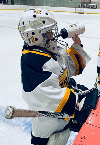 Brandon Wheat King U13 AA goalie Amara Reichert hydrates during a timeout while playing at Flynn Arena during the annual Tournament of Champions (TOC). (Photos by Jules Xavier/The Brandon Sun)