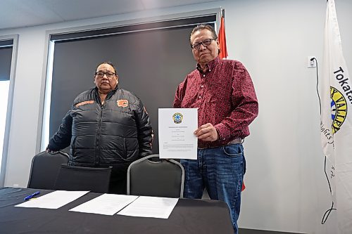 09022024
Sioux Valley Dakota Nation chief Vince Tacan holds up the memorandum of understanding signed by Tacan, Canupawakpa Dakota Nation chief Raymond Brown (left) and Dakota Plains First Nation chief Don Smoke, who joined the meeting via video-link, to work together to build a casino along the Trans Canada Highway at Highway 21 south of Sioux Valley Dakota Nation. 
(Tim Smith/The Brandon Sun)