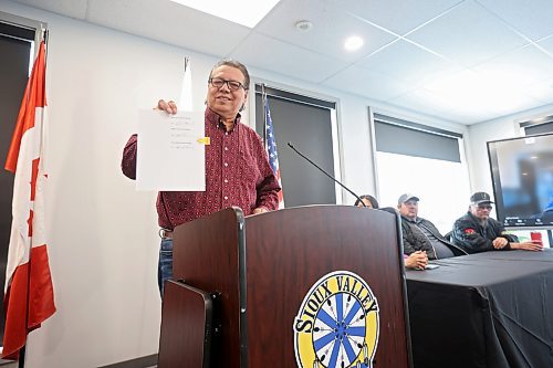 09022024
Sioux Valley Dakota Nation chief Vince Tacan holds up the memorandum of understanding signed by Tacan, Canupawakpa Dakota Nation chief Raymond Brown and Dakota Plains First Nation chief Don Smoke to work together to build a casino along the Trans Canada Highway at Highway 21 south of Sioux Valley Dakota Nation during a press conference at Sioux Valley on Friday morning. 
(Tim Smith/The Brandon Sun)