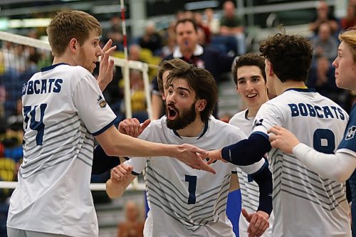 JJ Love (1) cheers after a Tom Friesen (14) kill in Brandon University's five-set win over Thompson Rivers in Canada West men's volleyball on Saturday. (Thomas Friesen/The Brandon Sun)