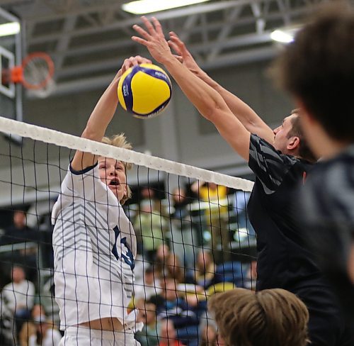 Brandon's Liam Pauls tips a ball past TRU's Sam Elgert. (Thomas Friesen/The Brandon Sun)