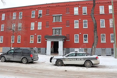 Police remained on scene at 285 College Ave. apartment on Sunday, where three officers were shot and wounded during an armed standoff the previous day. (Tyler Searle/Winnipeg Free Press)