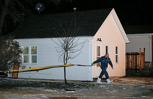 JOHN WOODS / WINNIPEG FREE PRESS
RCMP investigate at 110 3rd St NW in Carman, the scene of a murder, Sunday, February 11, 2024. 

Reporter: tyler