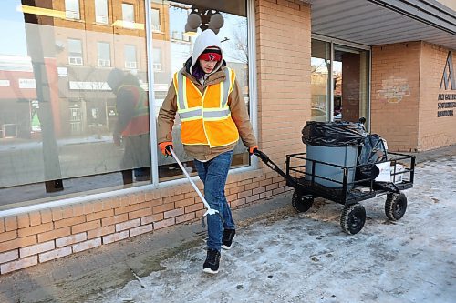 12022024
Julian McKay with the BNRC Fresh Start Specialty Cleaning Service cleans up litter from along Rosser Avenue in Brandon on a mild Monday.
(Tim Smith/The Brandon Sun)