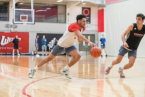 BROOK JOJNES / WINNIPEG FREE PRESS
University of Winnipeg Wesmen men's basketball team guard Malachi Alexander, who graduated from &#xc9;cole Sisler High School, is pictured dribbling the basketball during a scrimmage at practice at the Dr. David F. Anderson Gymnasium inside the Duckworth Centre at the University of Winnipeg in Winnipeg, Man., Tuesday, Feb. 13, 2024.