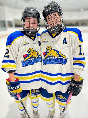 Friends and teammates with the second-place Westman Wildcats, vetarans Addison Vines (2) and Hallie Franklin (17) posed for a post-game portrait after their team prevailed 3-1 facing the visiting fifth-place Winnipeg Avros in Hartney. (Jules Xavier/The Brandon Sun)
