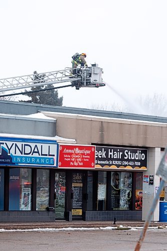 MIKE DEAL / WINNIPEG FREE PRESS
Many of the businesses at a strip mall at 1030 Keewatin Street have been destroyed by a fire that started early Monday morning. WFPS crews were still on scene dousing the building via ladder trucks.
240212 - Monday, February 12, 2024.