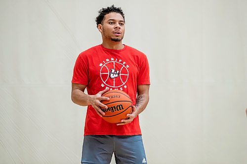 BROOK JOJNES / WINNIPEG FREE PRESS
University of Winnipeg Wesmen men's basketball team guard Malachi Alexander, who graduated from &#xc9;cole Sisler High School, is pictured with a basketball during practice at the Dr. David F. Anderson Gymnasium inside the Duckworth Centre at the University of Winnipeg in Winnipeg, Man., Tuesday, Feb. 13, 2024.