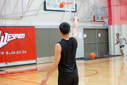 BROOK JOJNES / WINNIPEG FREE PRESS
University of Winnipeg Wesmen men's basketball team guard Shawn Maranan, who graduated from &#xc9;cole Sisler High School, is pictured with his follow through after shooting a basketball during team practice at the Dr. David F. Anderson Gymnasium inside the Duckworth Centre at the University of Winnipeg in Winnipeg, Man., Tuesday, Feb. 13, 2024.
