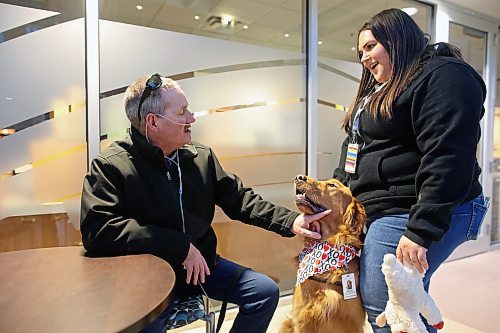 14022024
Stephanie Hofer (right) and her dog Waylon with Prairie Area Therapy Dogs (PATDogs) visit with Steven Logan in the atrium at the Brandon Regional Health Centre on Wednesday evening.
(Tim Smith/The Brandon Sun)