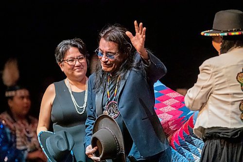 BROOK JONES / WINNIPEG FREE PRESS
Ernest Monias , who is also known as &quot;Elvis of the North&quot; and &quot;King of the North,&quot; is a country music rocker from Pimicikamak Cree Nation (Cross Lake). Pictured: Monias (middle) waves to the crowd while he is presented with a star-blanket by life-givers Pimicikamak Cree First Nation (Cross Lake) Coun. Brenda Frogg (left) and Assembly of Manitoba Chiefs Grand Chief Cathy Merrick (right) during an honouring ceremony in celebration of his 75th birthday at the Burton Cummings Theatre in Winnipeg, Man., Sunday, Feb. 18, 2024. Monias, who has been performing for 60 years, was inducted into the Manitoba Aboriginal Music Hall of Fame in 2005.
