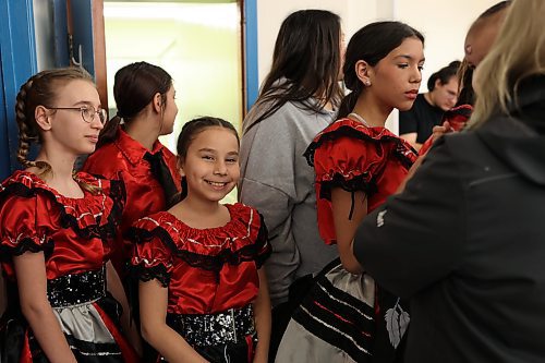 Chloe Lavallee (centre) and other members of the Dauphin Friendship Centre Diversity Dancers wait to perform a square dance routine during Louis Riel Day celebrations at the Manitoba Métis Federation’s southwest region’s building in Brandon on Monday. (Michele McDougall/The Brandon Sun)    