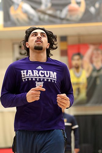 Sultan Bhatti, shown at Bobcats men's basketball practice in front of a promotional banner featuring the third-year forward, was named a Canada West second-team all-star on Tuesday. (Thomas Friesen/The Brandon Sun)