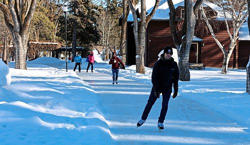 Visitors to Wasagaming in Riding Mountain National Park skate along frozen trails behind the visitor's centre on Saturday. (Colin Slark/The Brandon Sun)