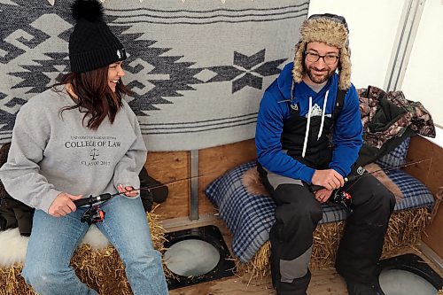 Stephan and Brooke Branigan enjoy some ice fishing inside a tent on Clear Lake on Saturday. (Colin Slark/The Brandon Sun)