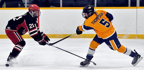 During first period action in Shoal Lake on Thursday night, Yellowhead Chiefs forward Dara Thompson (5) slaps a low shot past Winnipeg Avros defender Evangeline West. The Avros won Game 1 of their best-of-five quarterfinal U18 AAA Manitoba Female Hockey League 4-3 thanks to the game-winner scored with .09 seconds on the clock by Mackenzie Lizotte. (Photos by Jules Xavier/The Brandon Sun)