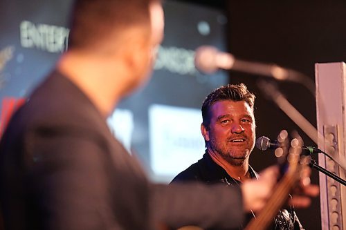 Doc Walker singer Chris Thorsteinson looks over at fellow musician Dave Wasyliw during the song A Beautiful Life during a special accoustic performance at the Provincial Exhibition of Manitoba's President's Dinner on Thursday evening. (Matt Goerzen/The Brandon Sun)