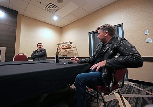 Doc Walker tour manager Ian Leary, left, talks with band front man Chris Thorsteinson during an impromptu interview with The Brandon Sun before taking the stage during the Provincial Exhibition of Manitoba's President's Dinner on Thursday night at the Victoria Inn. 
