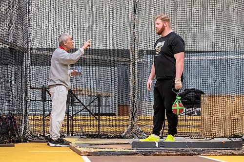 BROOK JONES / WINNIPEG FREE PRESS
University of Manitoba Bisons men's track &amp; field team assistant coach Mingpu Wu (right) gives pointers to weight thrower Graham Wright during a training training session at the James Daly Fieldhouse at the University of Manitoba Fort Garry campus in Winnipeg, Man., Tuesday, Feb. 27, 2024. The Bisons men's team captured the Canada West Track &amp; Field Championships for the third year in a row. Wright will be competing at the upcoming U Sports Track &amp; Field Championships in Winnipeg March 7 to 9, 2024.